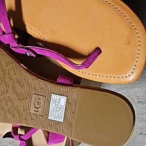 Ugg Modeena flats .thong sandal with embroidered uggs silver hardware.